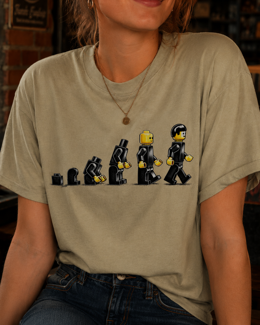 Brick Evolution – Toybox Darwinism – Vintage Pop Tee